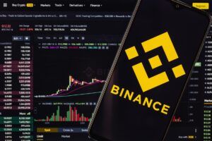Logo von Binance für einer Kurve mit Kursverläufen