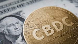 Abbildung einer US Dollar Note und einer Münze